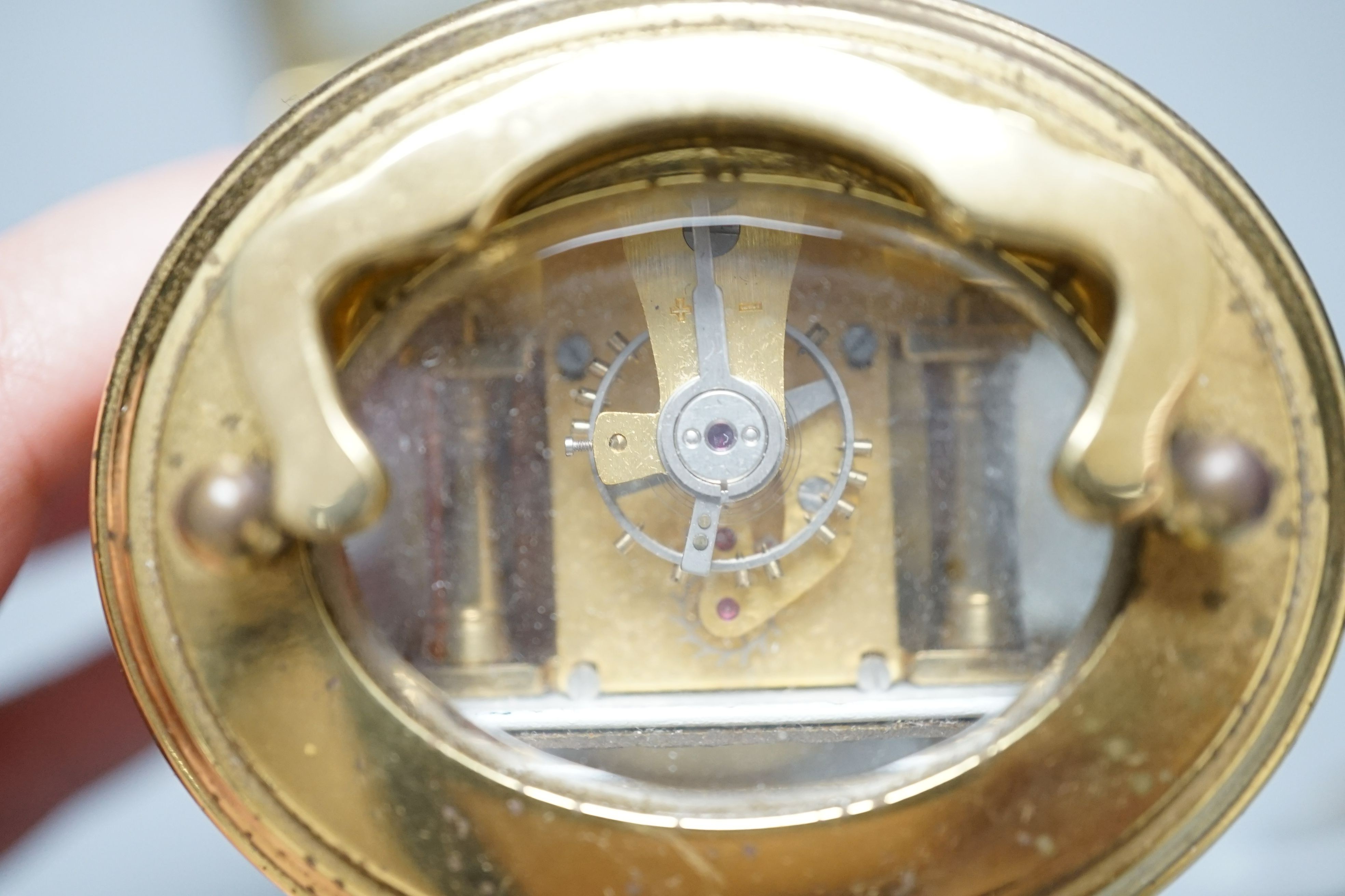 Two modern brass carriage timepieces, one oval cased